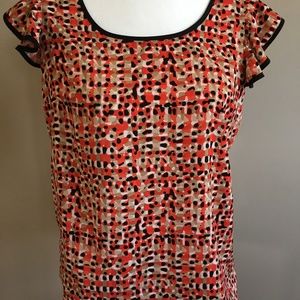 Orange, beige and black top